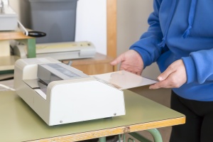 women working on laminating service for document
