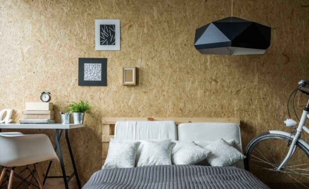 bed and wooden wall in ecological bedroom