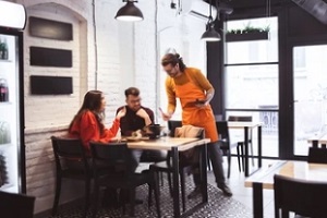 man taking order from customers