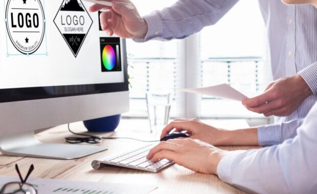 designer team sketching a logo in digital design studio on computer