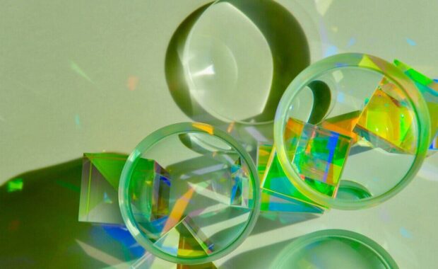 convex concave lens on top of dichroic glass cube prism magnifying image