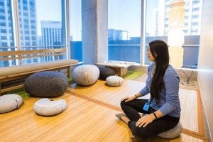 employee meditating in office quiet room