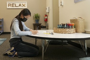 girl sitting in school calming room