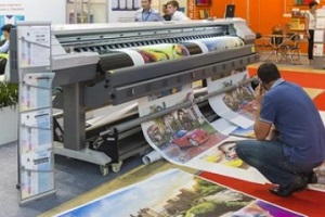 people working with large format printer