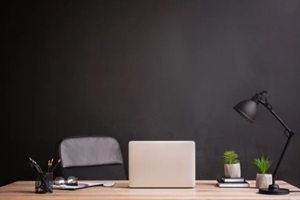 stylish workplace with modern laptop near dark custom wall covering