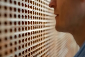 man standing near acoustic wall panel