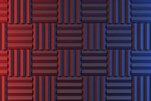 wall of acoustic foam panels illuminated by red and blue lights