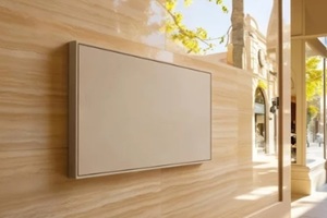 modern exterior design featuring a sleek wall with a mounted display and contemporary architecture background