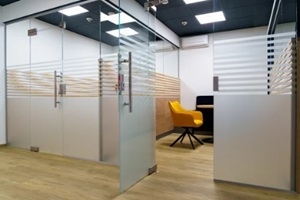 modern office with glass partitions and stylish seating area