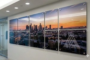 acrylic wall art of city in office hallway
