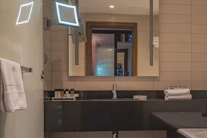 an acrylic mirror installed in bathroom