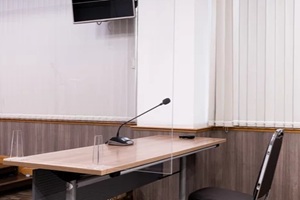 conference table with clear plastic partition 