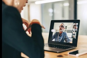 businesswoman speaking during a virtual meeting