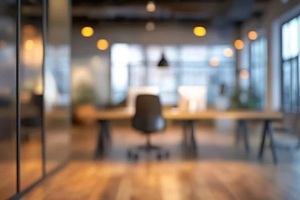 modern office workspace interior design blurred background abstract desk room dark wood gray chair
